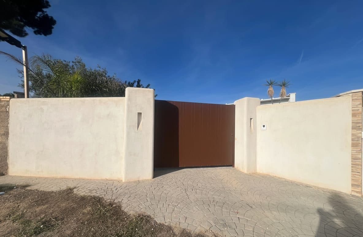 Reconstrucción Entrada a Villa Emi
